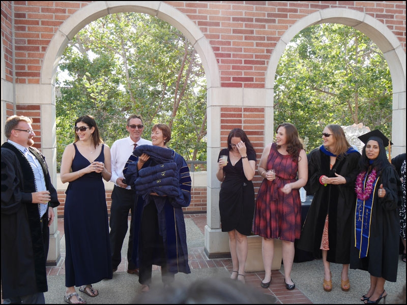 Five of the six recent graduates in Egyptian archaeology are acknowledged during the reception on the roof of the Fowler Museum.
