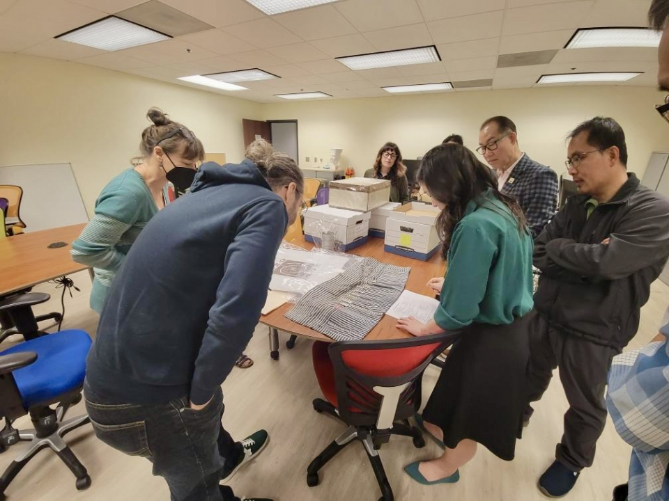 RMCI team and affiliates reviewing artifacts